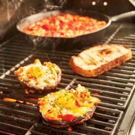 Egg-filled mushrooms and smoked trout on the grill? This recipe is a delicious way to start your day