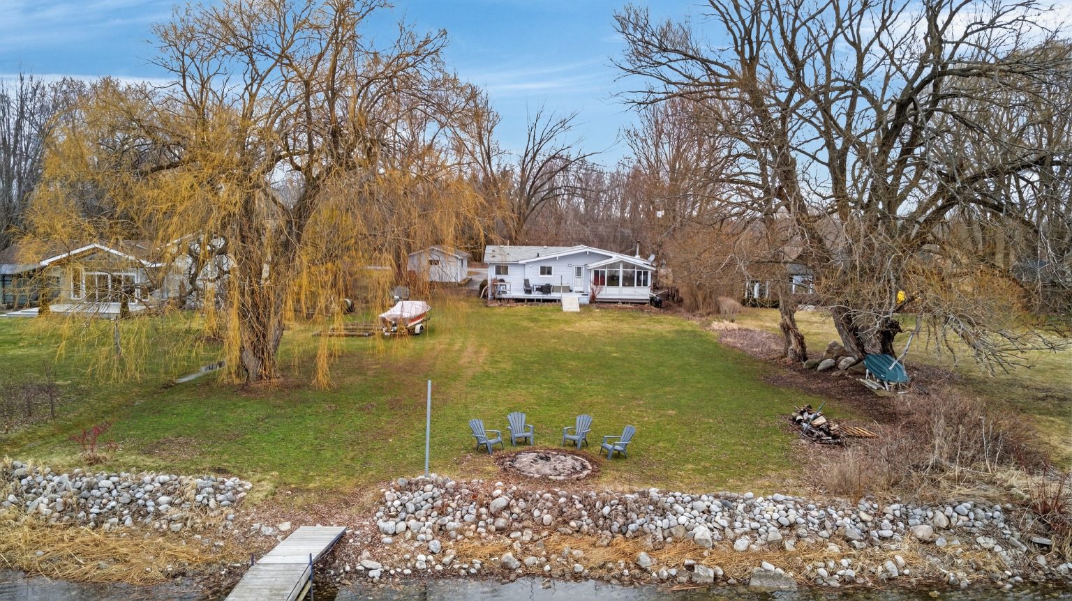 This $659K cottage in Prince Edward County has a sun room and nearly 100 feet of shoreline