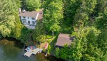 This $1.13 million cottage in Ramara comes with two bunkies and a sunroom