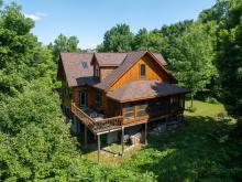 $1.39 million for a classic log cottage with cathedral windows near Westport