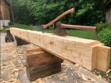 This is how you can use an axe or an adze to expertly craft a hand-hewn wooden beam