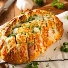 This baked ham, cheese, and veggie pull-apart bread is an easy way to feed a morning crowd